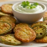 Delicious homemade jalapeño chips fresh from the oven with a side of dip.