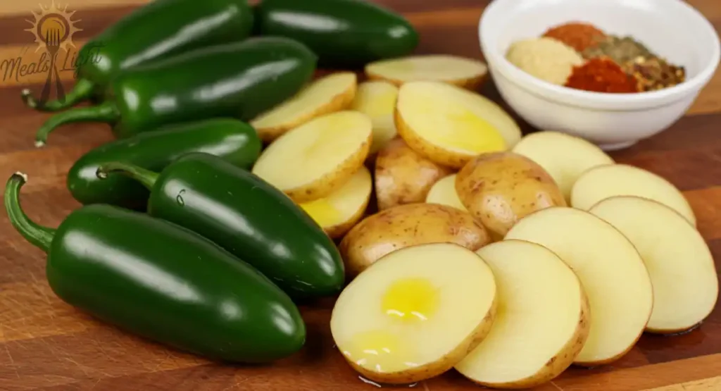 Ingredients for homemade jalapeño chips: fresh jalapeños, potatoes, olive oil, and seasonings.